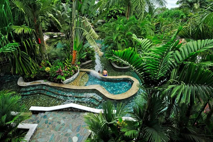 Thermal water slide pool near Arenal Volcano on a San Jose day trip hot springs tour in La Fortuna, Costa Rica